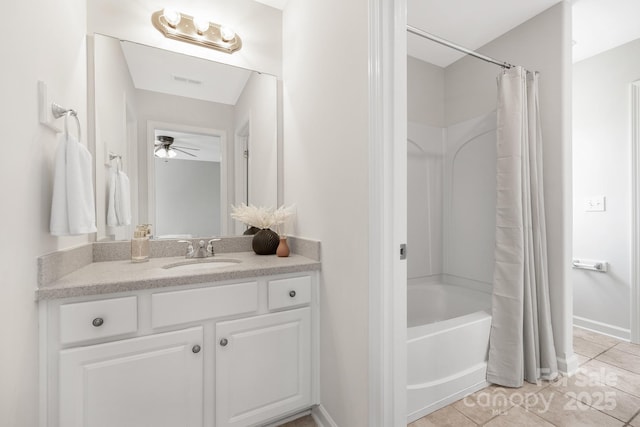 full bath with ceiling fan, baseboards, shower / tub combo with curtain, vanity, and tile patterned flooring