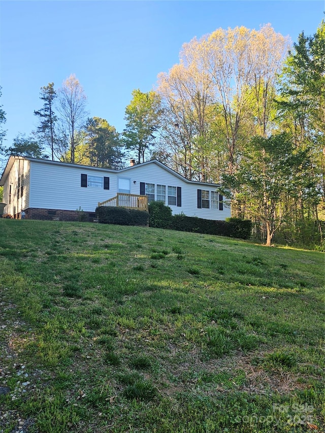 112 Thunder Rd, China Grove, NC 28023 - rear view of property featuring a lawn, a wooden deck, and crawl space