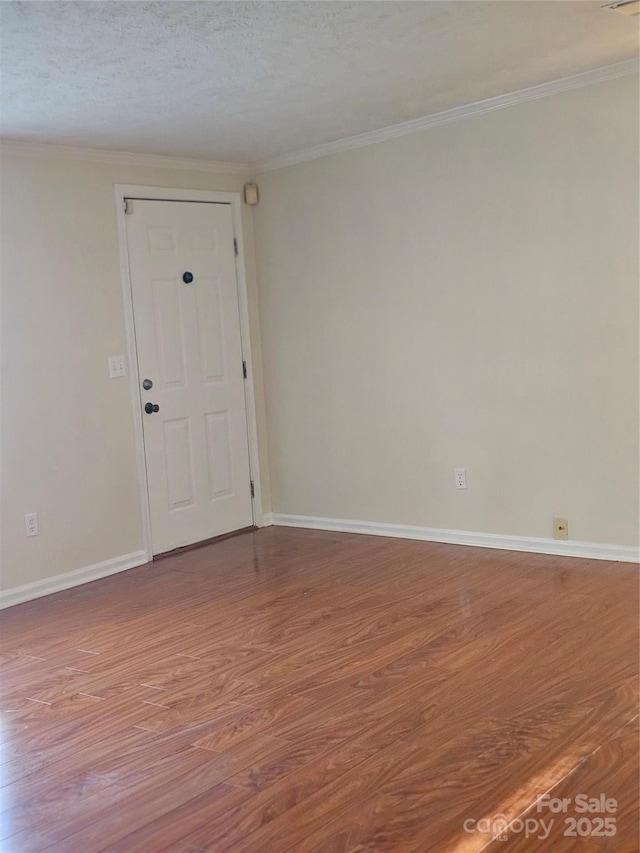 112 Thunder Rd, China Grove, NC 28023 - spare room featuring wood finished floors, baseboards, and ornamental molding