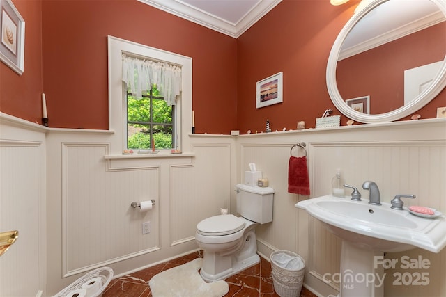 168 Chattooga Run, Hendersonville, NC 28739 - half bathroom with toilet, a decorative wall, a wainscoted wall, crown molding, and a sink