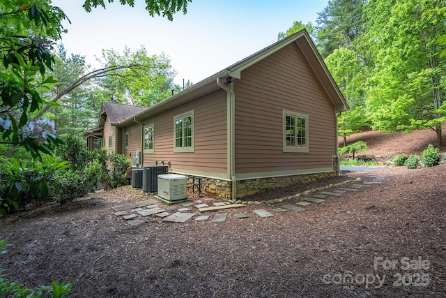168 Chattooga Run, Hendersonville, NC 28739 - view of property exterior featuring central AC unit