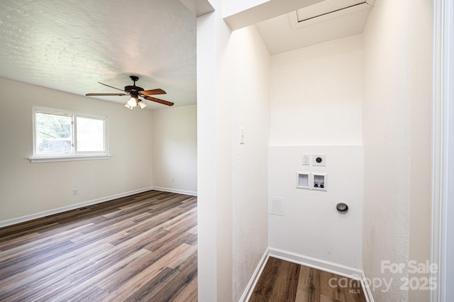 clothes washing area with ceiling fan, hookup for a washing machine, electric dryer hookup, baseboards, and dark wood-style floors