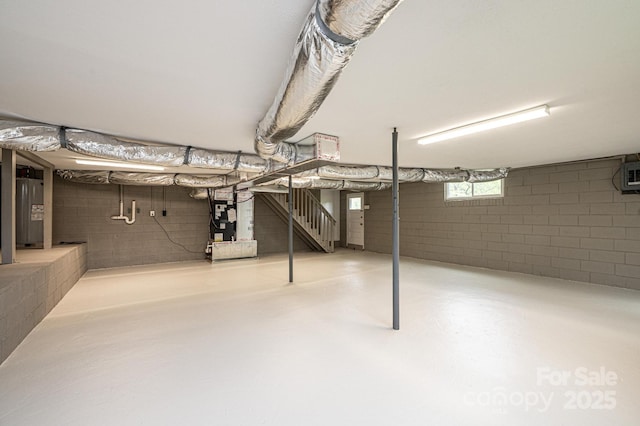 basement with water heater and heating unit