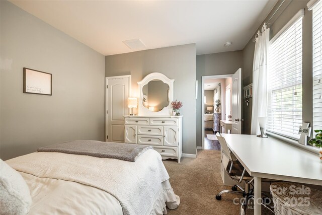 carpeted bedroom with baseboards, multiple windows, and visible vents