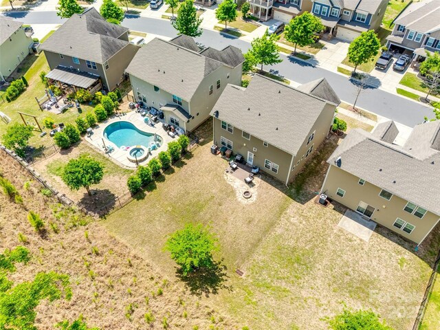 birds eye view of property with a residential view