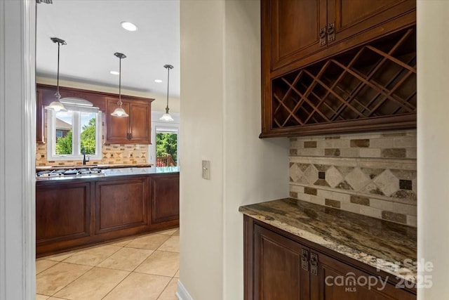bar area with backsplash, light tile patterned flooring, pendant lighting, recessed lighting, and stainless steel gas stovetop