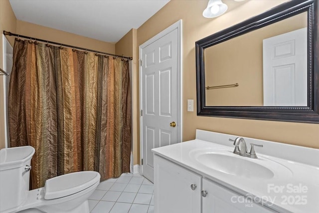full bathroom with tile patterned flooring, toilet, vanity, and curtained shower