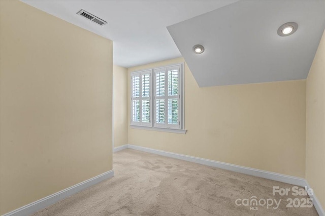bonus room with carpet floors, baseboards, and lofted ceiling