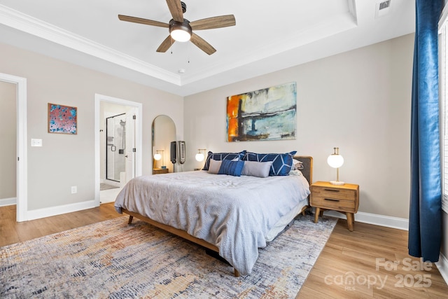 12705 Twilight Dr, Mint Hill, NC 28227 - bedroom with baseboards, a tray ceiling, light wood-type flooring, and visible vents