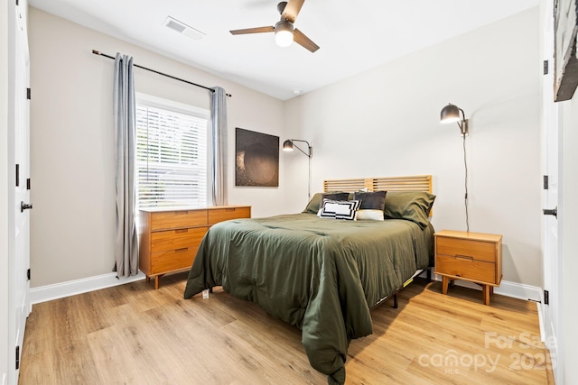 12705 Twilight Dr, Mint Hill, NC 28227 - bedroom with visible vents, light wood-style flooring, and baseboards