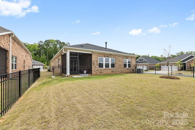 12705 Twilight Dr, Mint Hill, NC 28227 - back of house featuring cooling unit, a fenced backyard, a sunroom, brick siding, and a lawn