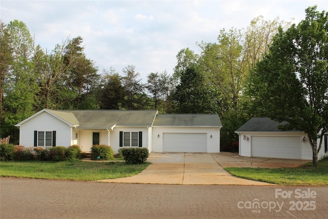 ranch-style home with a garage and a front lawn
