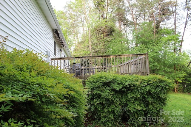 view of yard with a wooden deck