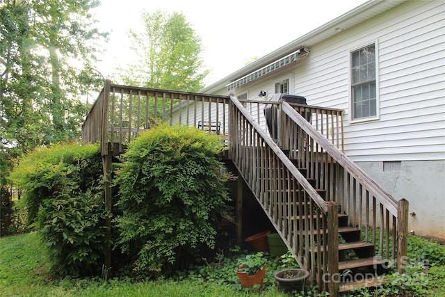 wooden deck featuring stairs
