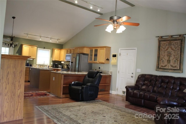 living area featuring dark wood-style flooring, baseboards, ceiling fan, track lighting, and high vaulted ceiling