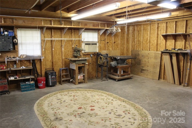 below grade area with a workshop area and cooling unit