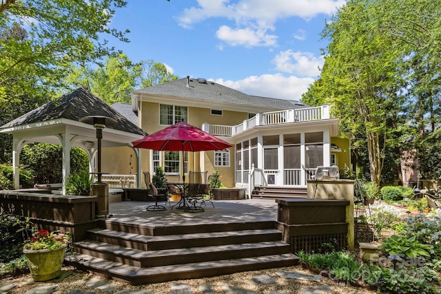 6914 Riesman Ln Unit 95, Charlotte, NC 28210 - rear view of house featuring a shingled roof, a balcony, a wooden deck, a gazebo, and a sunroom