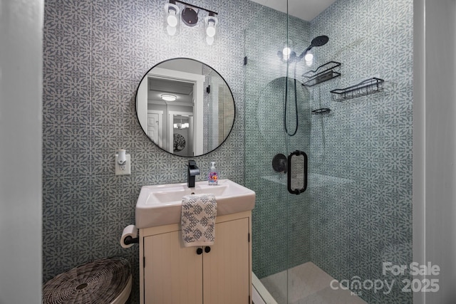 full bathroom featuring vanity and a stall shower