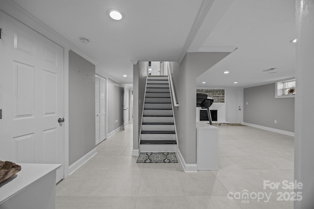 staircase featuring tile patterned floors, a fireplace, recessed lighting, and baseboards
