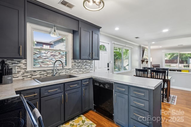 6412 Old Meadow Rd, Charlotte, NC 28227 - kitchen with black appliances, a sink, a peninsula, crown molding, and light countertops