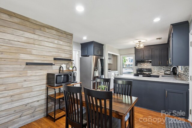 6412 Old Meadow Rd, Charlotte, NC 28227 - dining area with washer and clothes dryer, light wood-style flooring, and recessed lighting