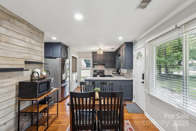 6412 Old Meadow Rd, Charlotte, NC 28227 - dining room with washing machine and clothes dryer, healthy amount of natural light, crown molding, wood finished floors, and recessed lighting