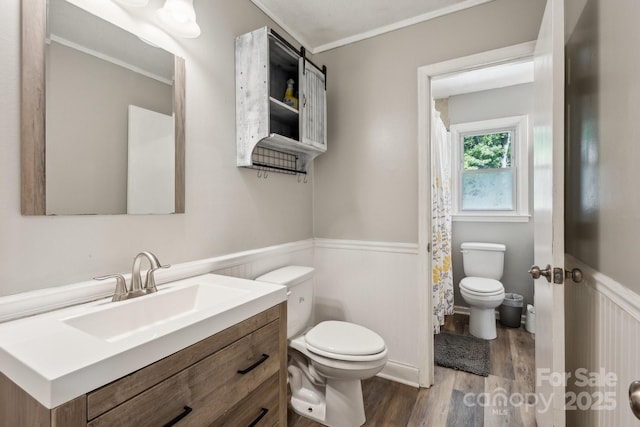 6412 Old Meadow Rd, Charlotte, NC 28227 - full bath featuring toilet, wainscoting, wood finished floors, vanity, and crown molding