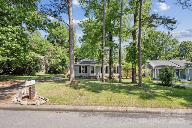 6412 Old Meadow Rd, Charlotte, NC 28227 - view of front of home featuring a front yard and view of wooded area