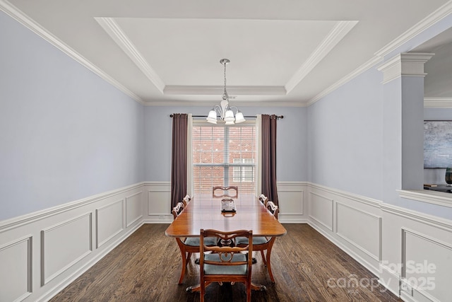 1948 Winpole Ln, Charlotte, NC 28273 - dining space with a raised ceiling, a wainscoted wall, dark wood-style flooring, and a chandelier
