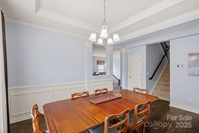 1948 Winpole Ln, Charlotte, NC 28273 - dining space featuring ornamental molding, a wainscoted wall, wood finished floors, and ornate columns