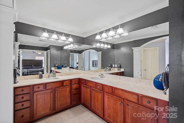 1948 Winpole Ln, Charlotte, NC 28273 - ensuite bathroom featuring tile patterned flooring, double vanity, a sink, and ornate columns