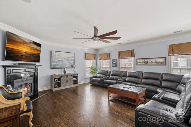 1948 Winpole Ln, Charlotte, NC 28273 - living room with ceiling fan, ornamental molding, healthy amount of natural light, wood finished floors, and a glass covered fireplace