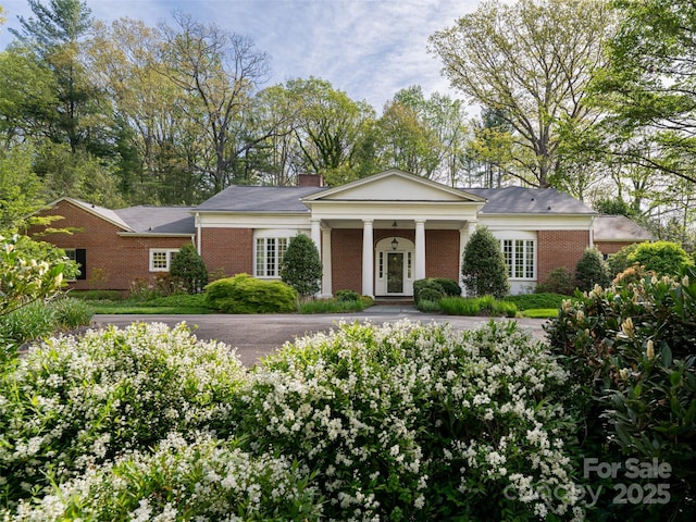 10 Stuyvesant Rd, Asheville, NC 28803 - greek revival inspired property with a chimney, brick siding, and covered porch