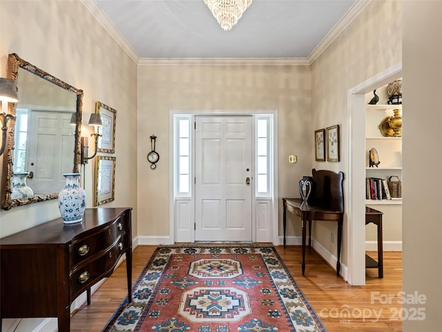 10 Stuyvesant Rd, Asheville, NC 28803 - entrance foyer featuring crown molding, a chandelier, and wood finished floors