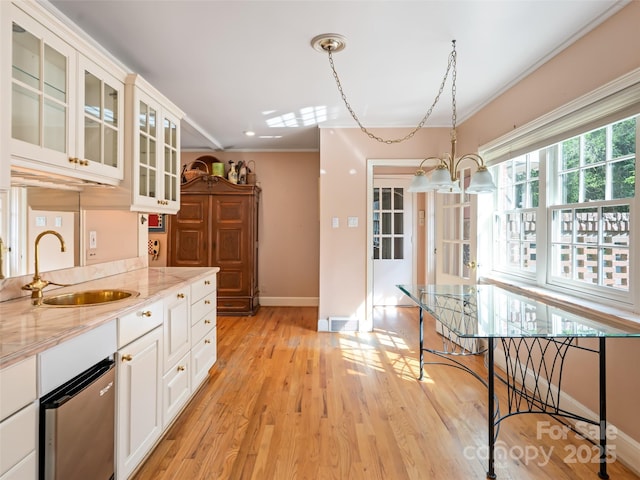 10 Stuyvesant Rd, Asheville, NC 28803 - kitchen with a sink, light wood-type flooring, baseboards, crown molding, and light stone countertops