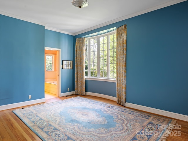10 Stuyvesant Rd, Asheville, NC 28803 - unfurnished room with baseboards, wood finished floors, and ornamental molding