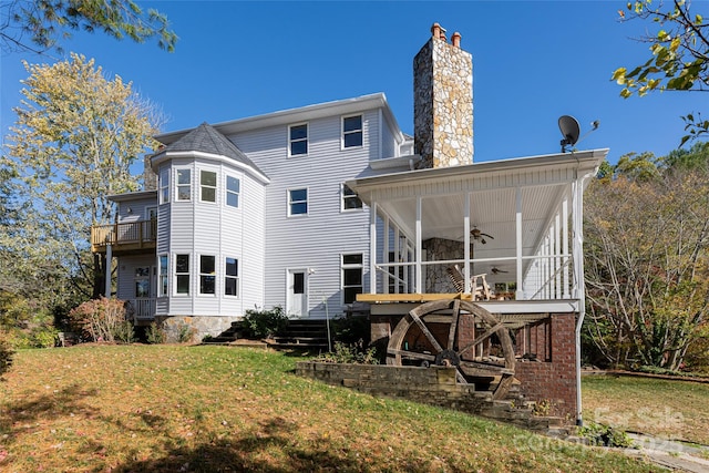 4950 Canterbury Pl, Morganton, NC 28655 - back of property with a chimney, ceiling fan, a sunroom, and a lawn