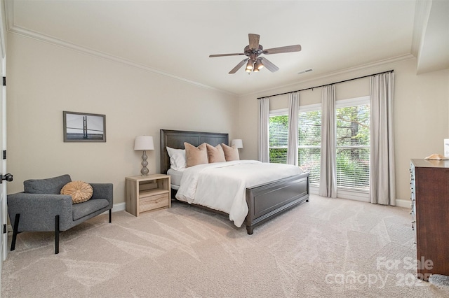 bedroom featuring light colored carpet, ornamental molding, baseboards, and ceiling fan