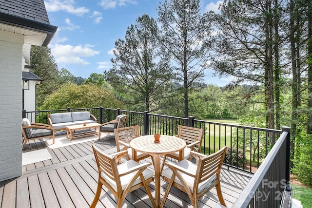 wooden terrace with outdoor lounge area and outdoor dining area