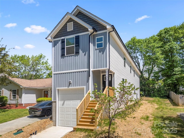 3205 Morning Dr, Charlotte, NC 28208 - view of front facade with board and batten siding, fence, an attached garage, and driveway