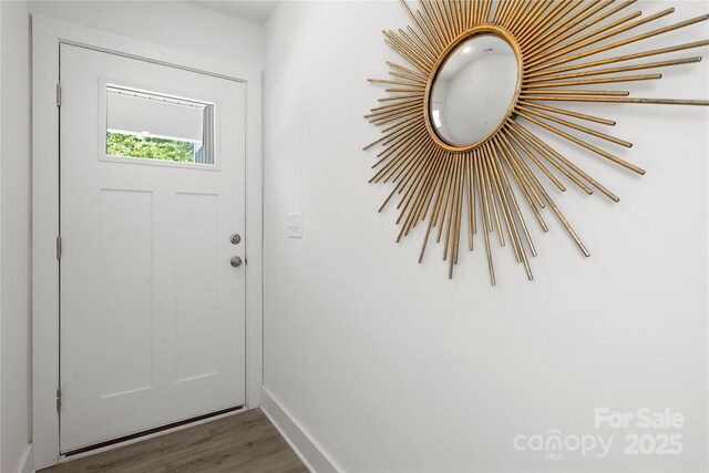 3205 Morning Dr, Charlotte, NC 28208 - doorway featuring baseboards and wood finished floors