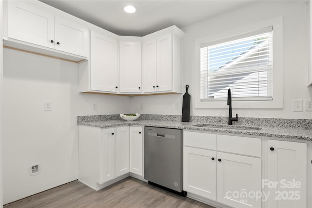 3205 Morning Dr, Charlotte, NC 28208 - kitchen featuring stainless steel dishwasher, recessed lighting, light wood-type flooring, white cabinetry, and a sink