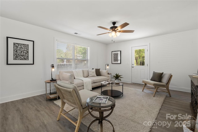 3205 Morning Dr, Charlotte, NC 28208 - living room with baseboards, a ceiling fan, wood finished floors, and visible vents