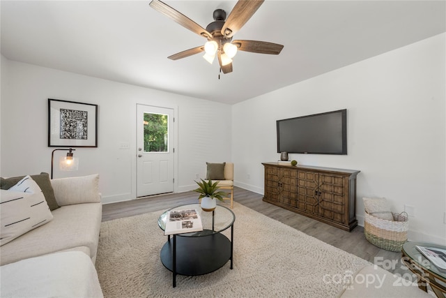 3205 Morning Dr, Charlotte, NC 28208 - living room featuring baseboards, a ceiling fan, and wood finished floors