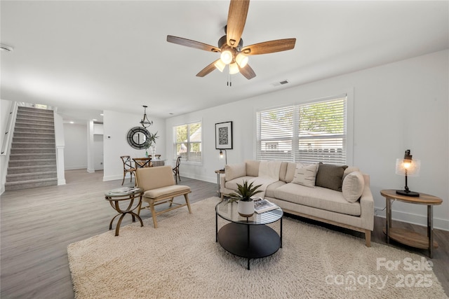 3205 Morning Dr, Charlotte, NC 28208 - living room with visible vents, stairs, baseboards, and wood finished floors