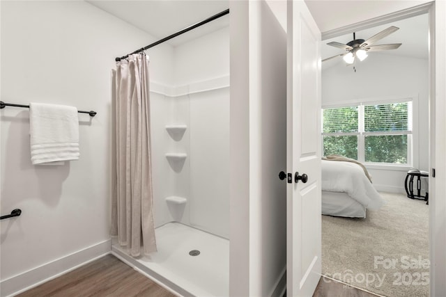 3205 Morning Dr, Charlotte, NC 28208 - ensuite bathroom featuring ceiling fan, baseboards, lofted ceiling, and a stall shower
