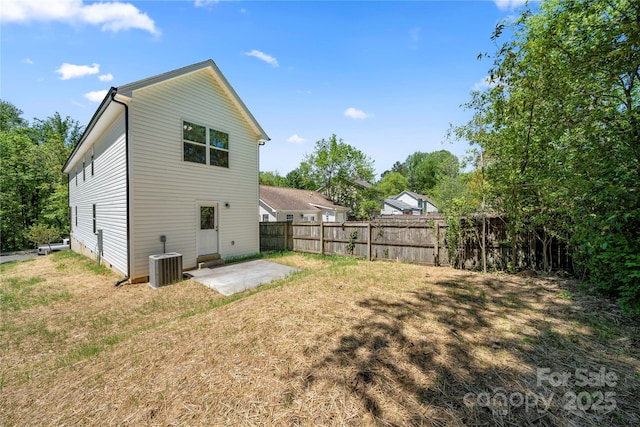 3205 Morning Dr, Charlotte, NC 28208 - back of property featuring central air condition unit, a patio area, fence, and a yard
