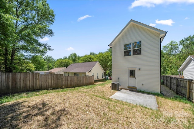 3205 Morning Dr, Charlotte, NC 28208 - rear view of house featuring a lawn, central AC unit, a fenced backyard, and a patio area