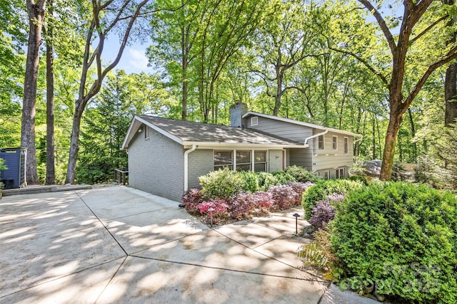 3329 Winnipeg Cir, Charlotte, NC 28210 - view of front of property with a chimney and brick siding