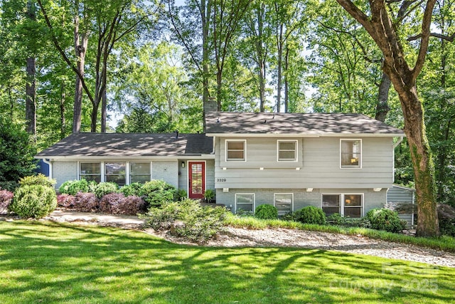 3329 Winnipeg Cir, Charlotte, NC 28210 - tri-level home with a front lawn and brick siding